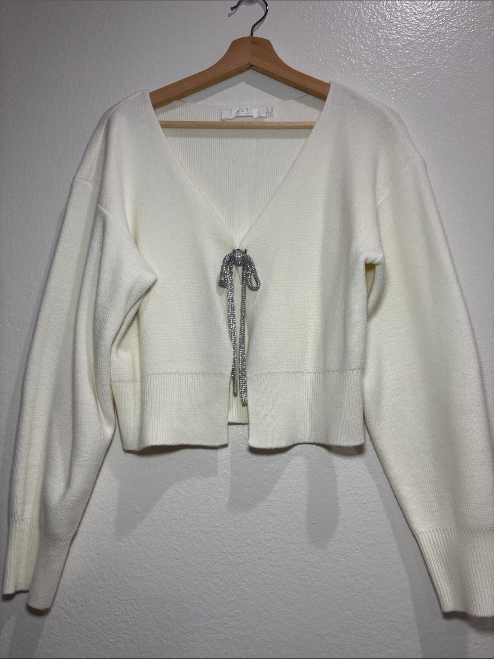 Astr Ivory cardigan with bow brooch size medium